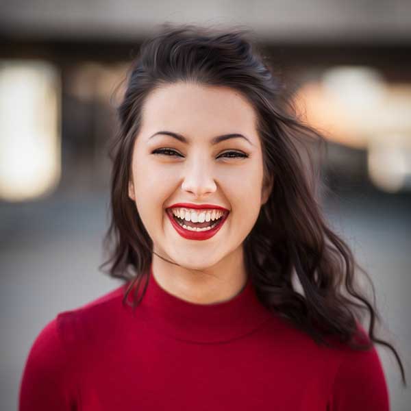 Woman in red dress smiling